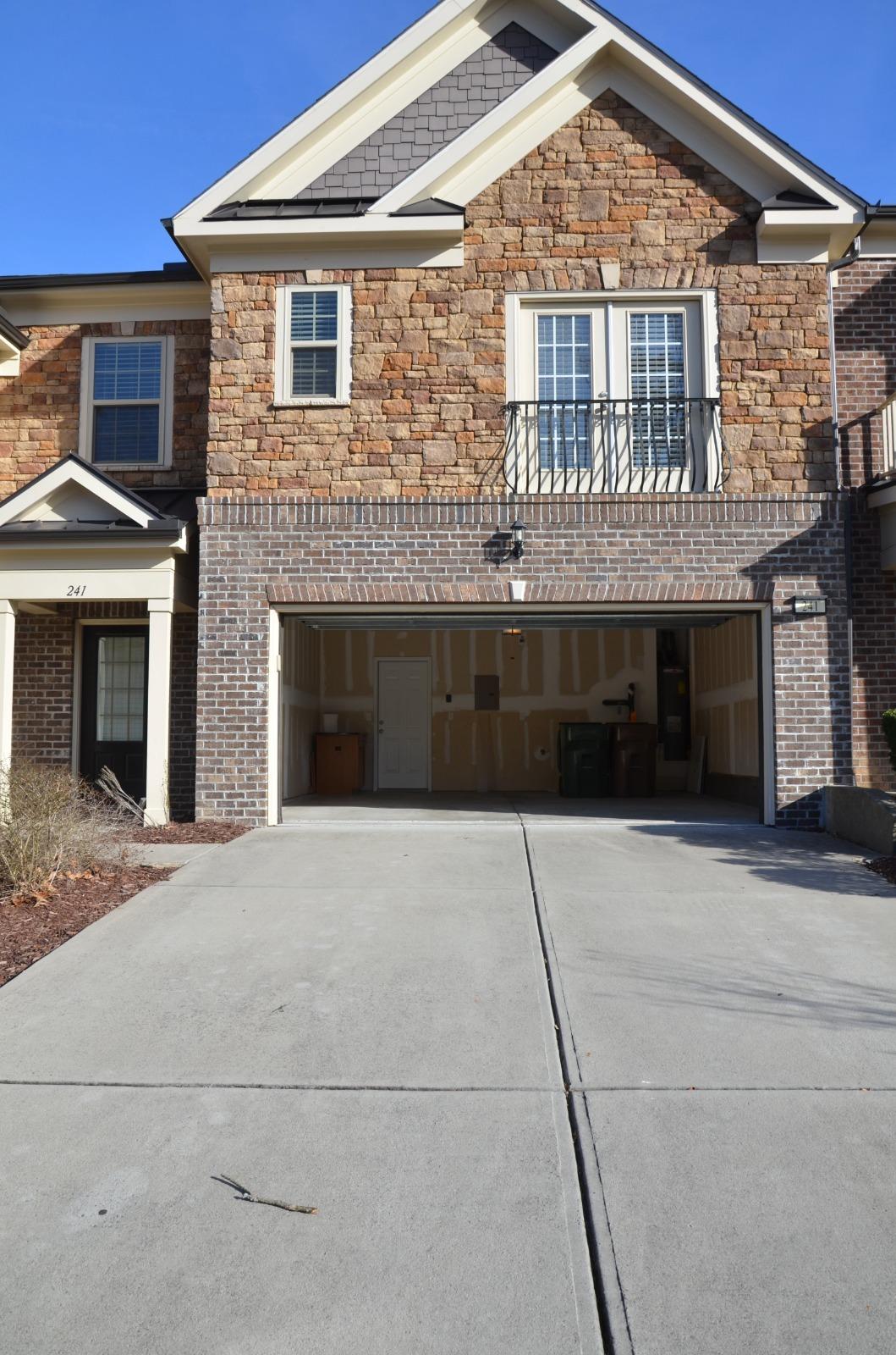 a front view of a house with yard