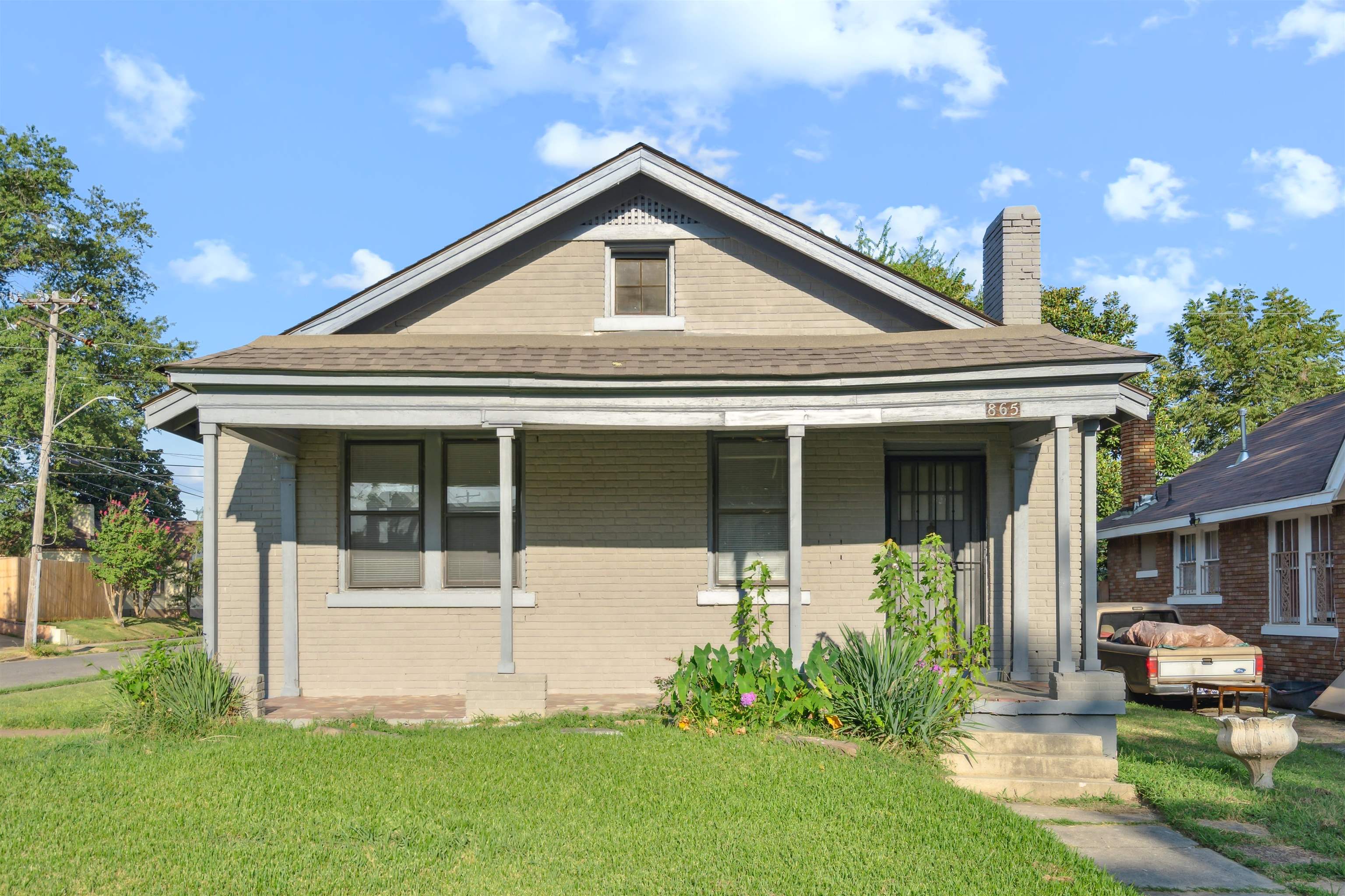 front view of a house with a yard