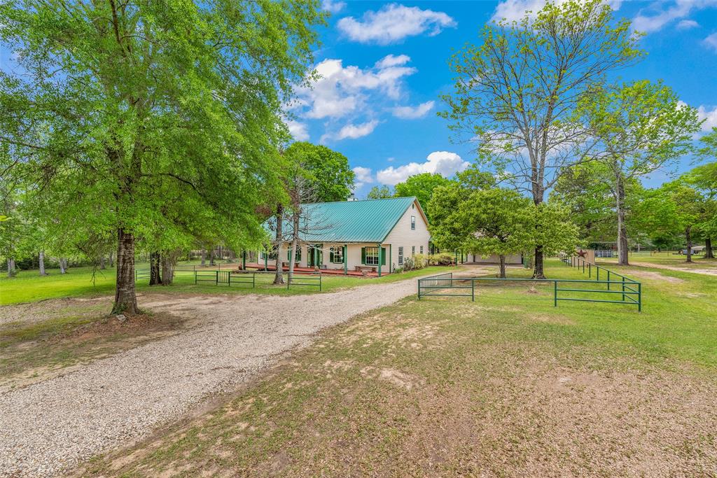 a view of a house with a big yard