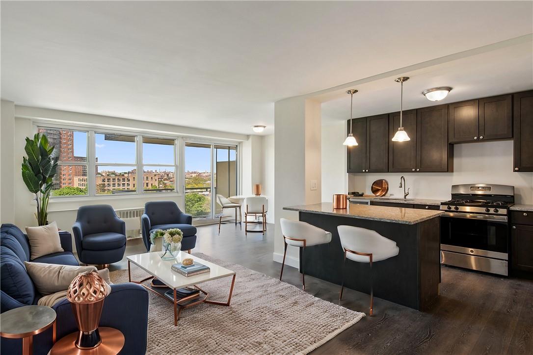 Living room with sink and dark hardwood / wood-style flooring