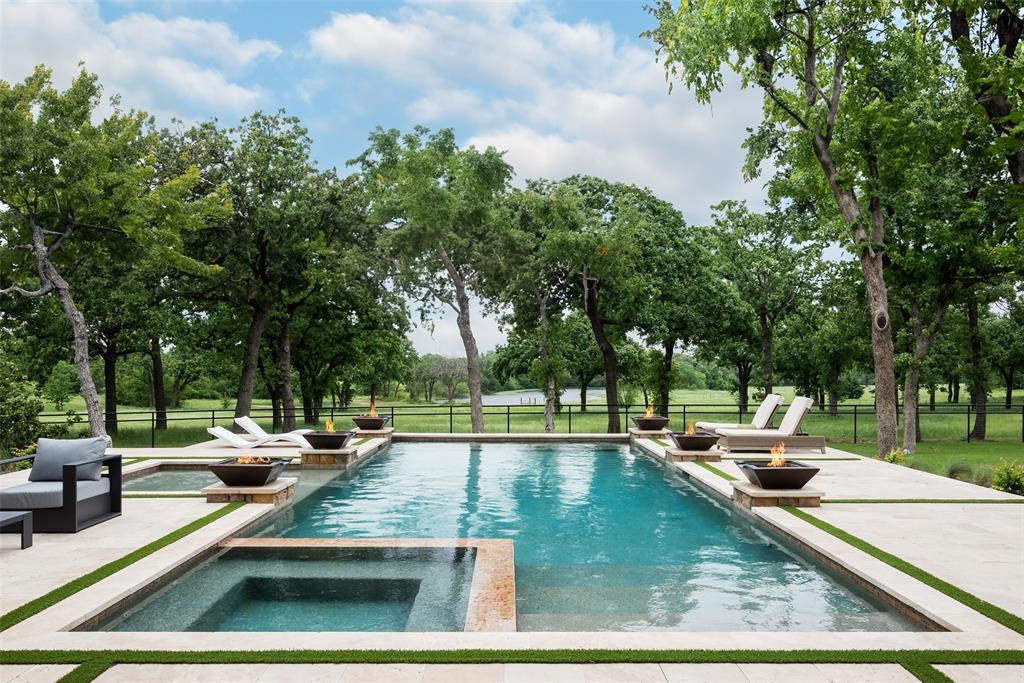 a view of a swimming pool with chairs