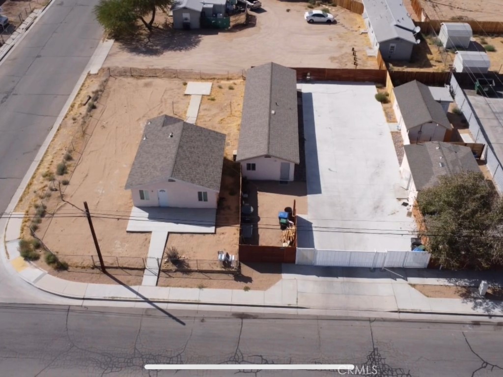 an aerial view of houses with outdoor space