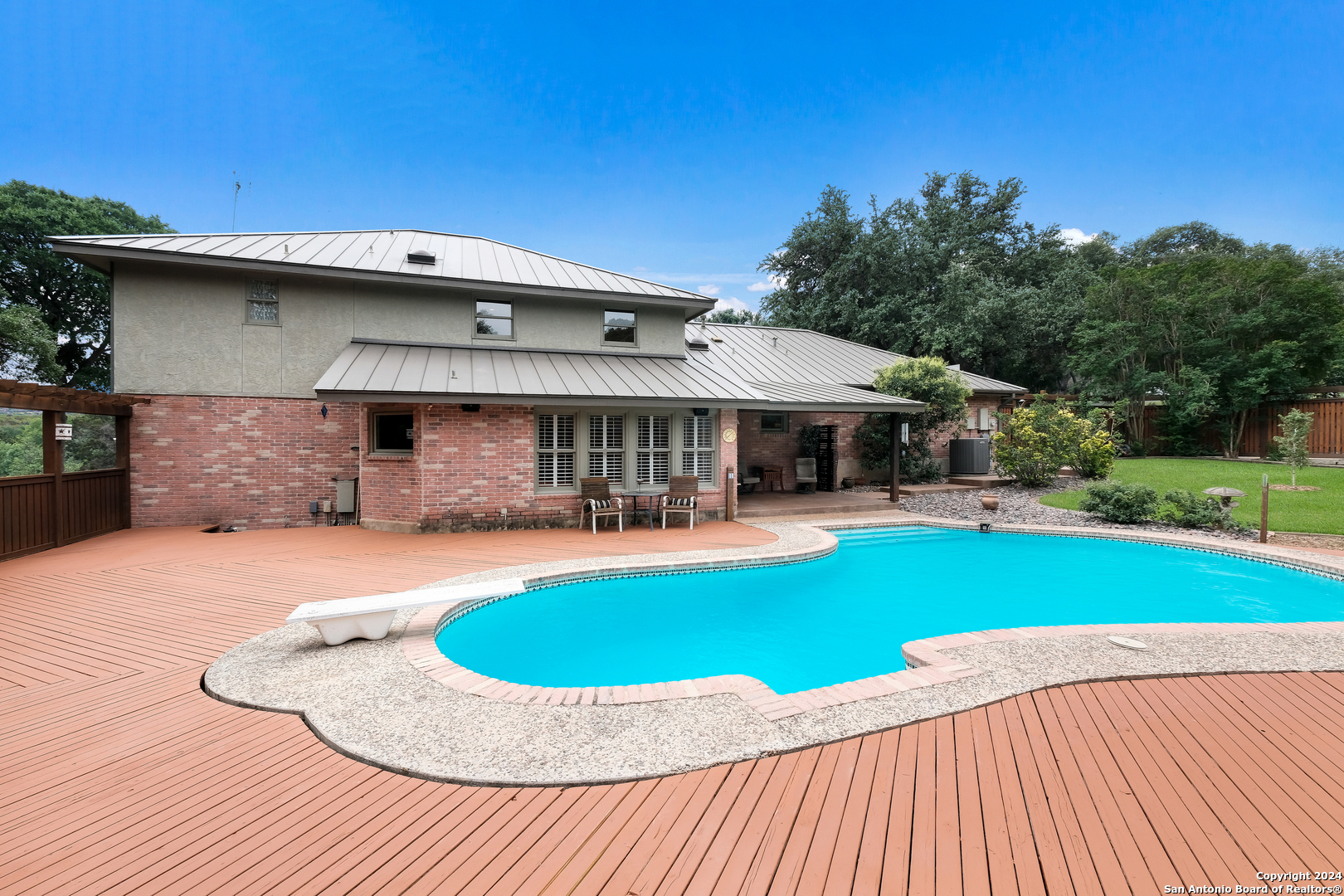 a view of a house with a swimming pool