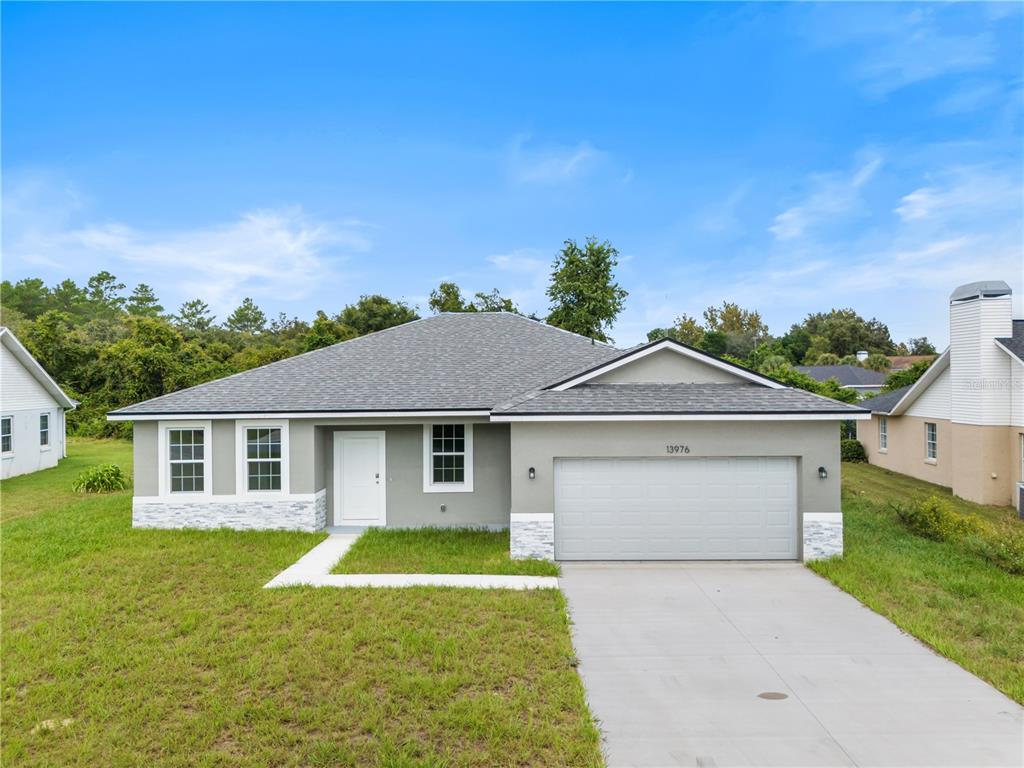 front view of a house with a yard