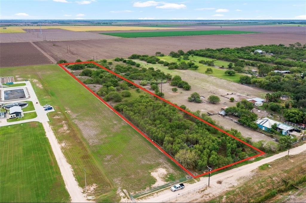 Birds eye view of property featuring a rural view