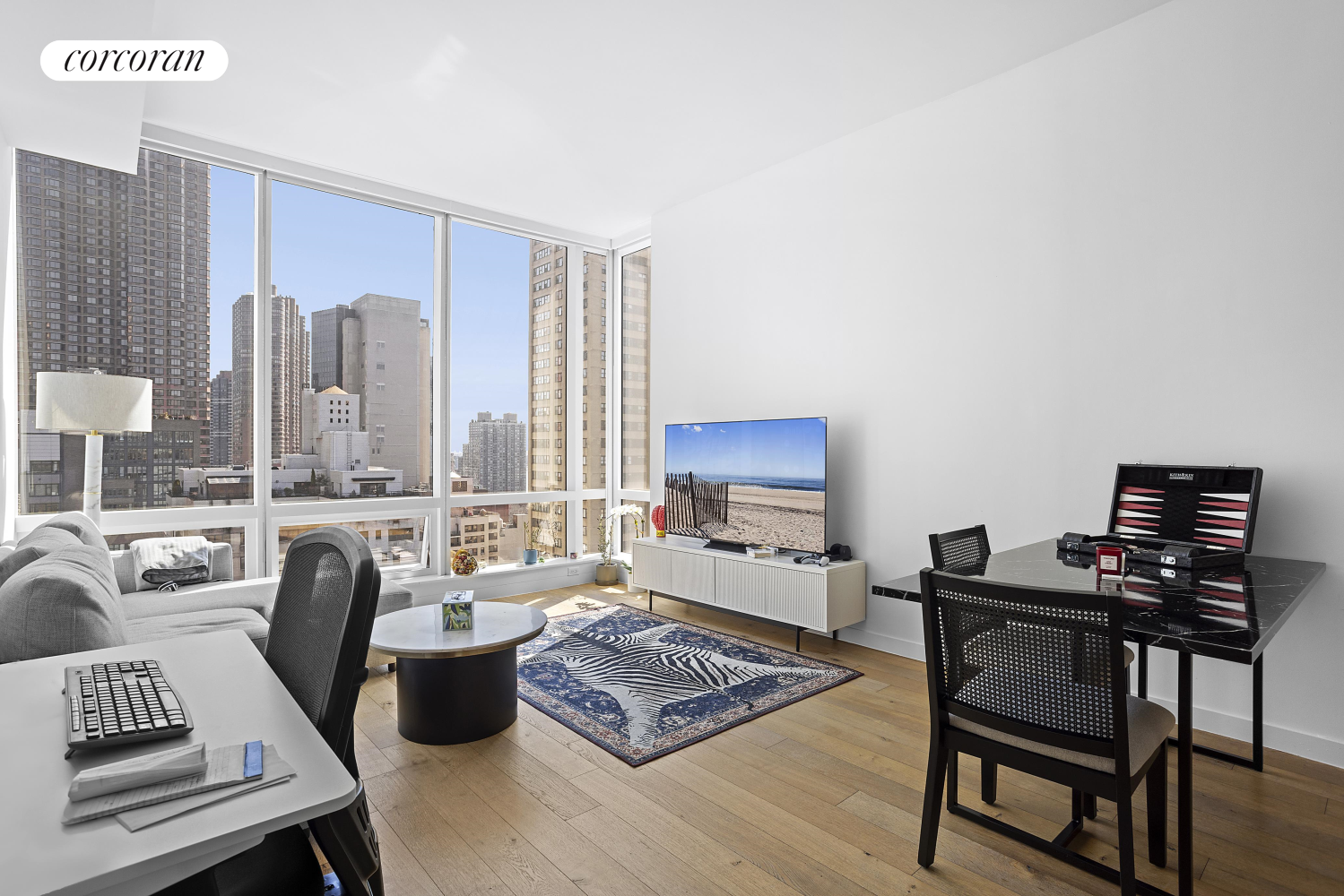 a living room with furniture and a flat screen tv