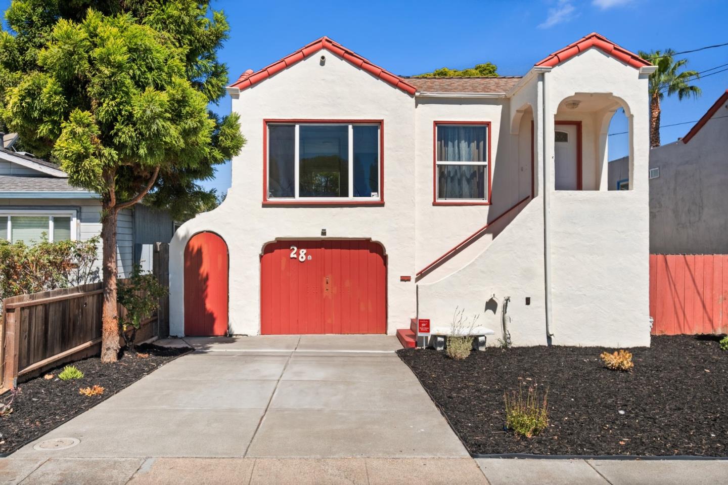 a front view of a house with yard