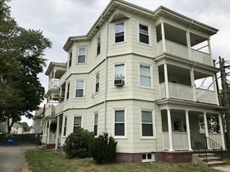 a large white building with a lots of windows