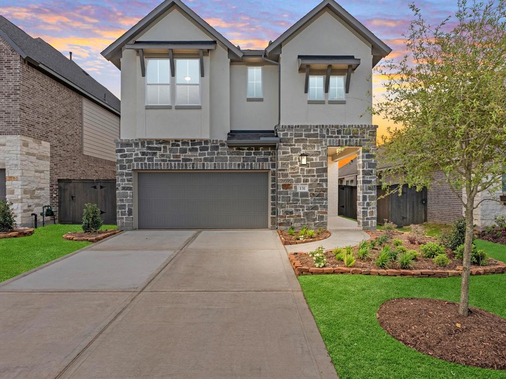 a front view of a house with garden