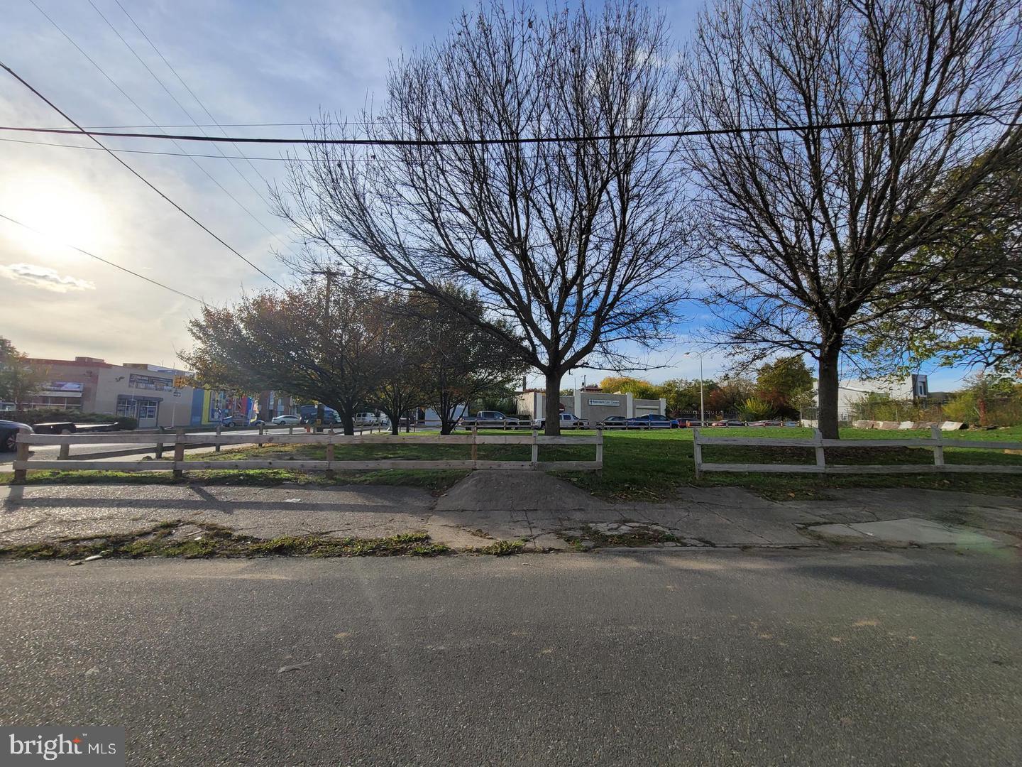 a view of street with large trees