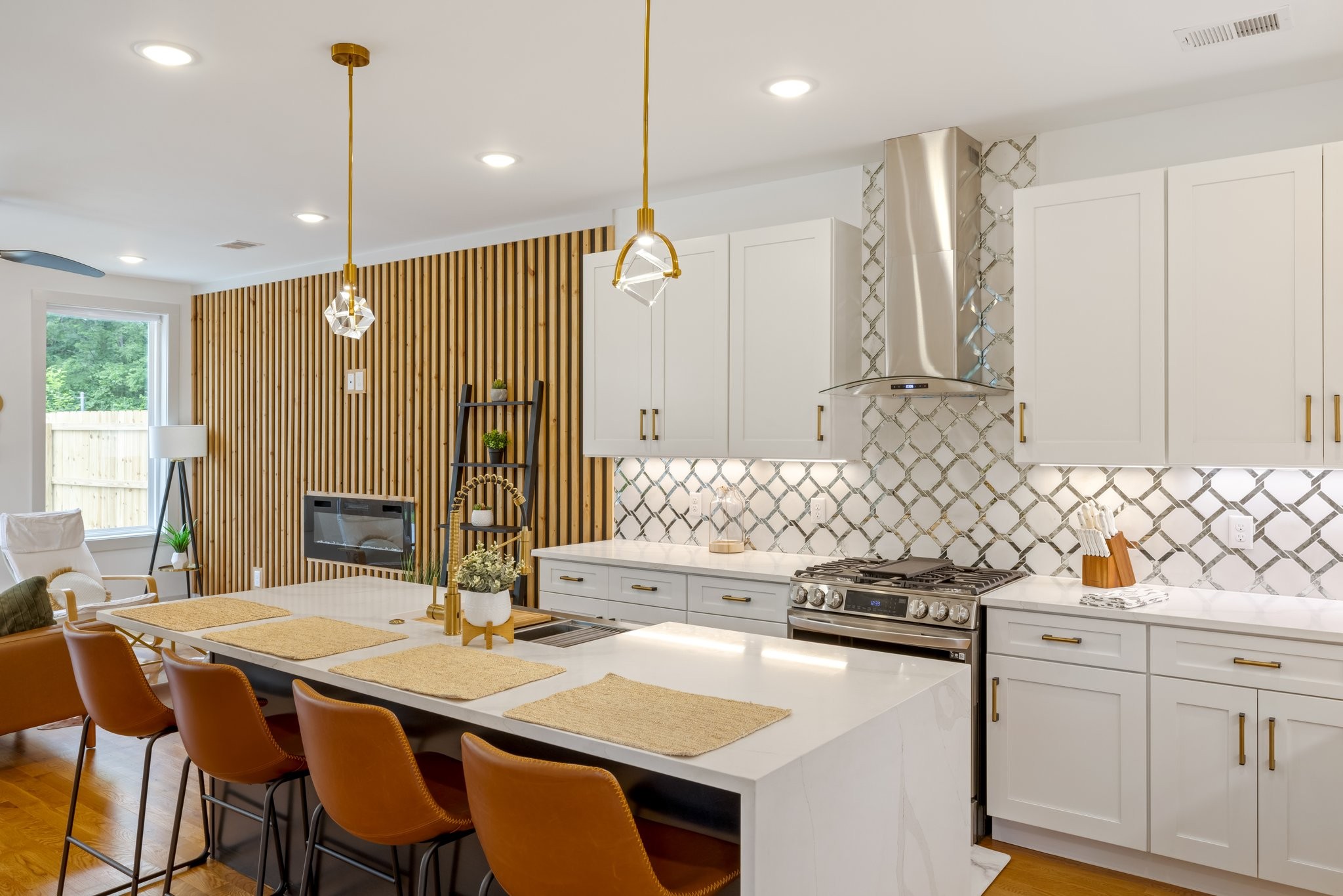 a kitchen with stainless steel appliances kitchen island granite countertop a sink and cabinets