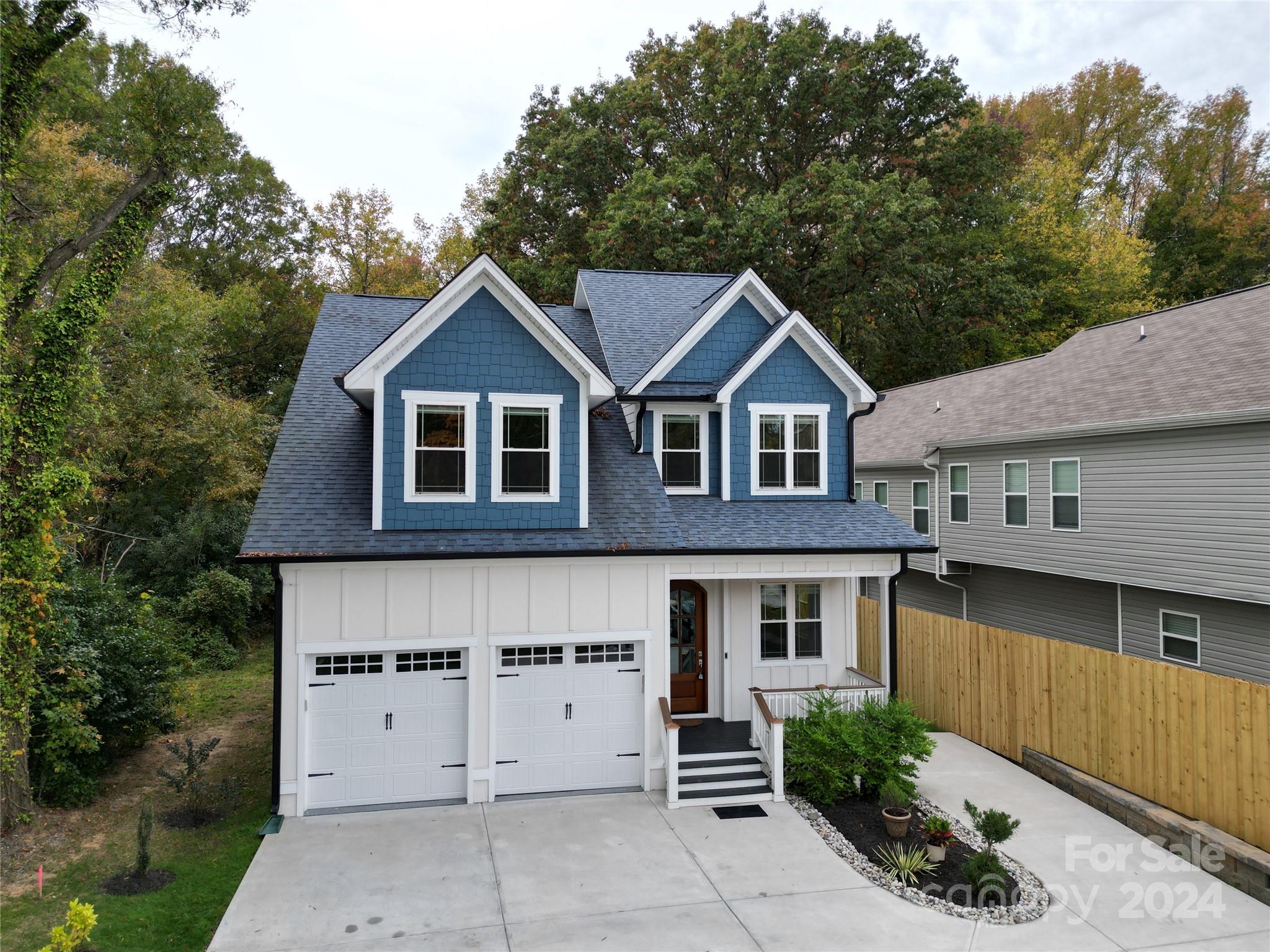 a front view of a house with a garage