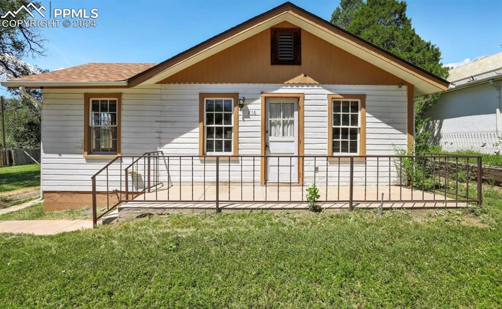 Bungalow-style home featuring a front yard