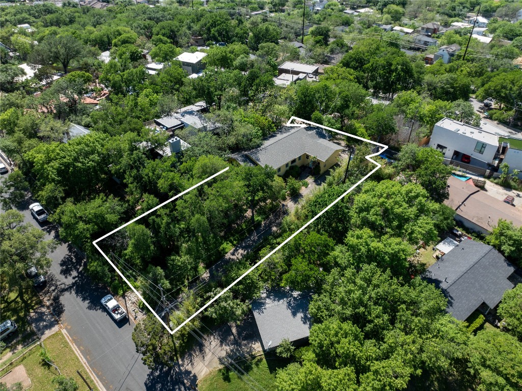 an aerial view of house with yard