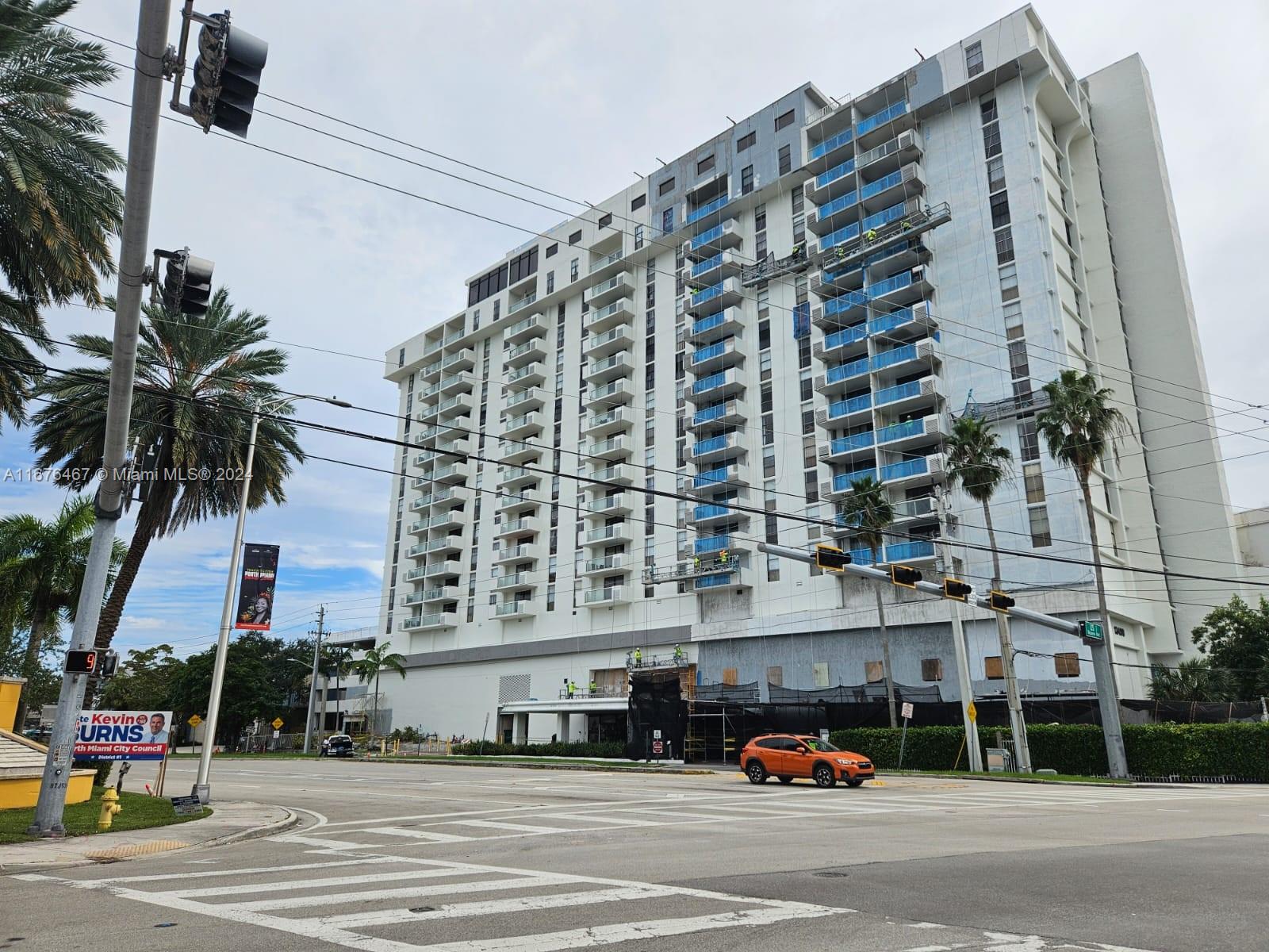 a front view of a building with street view