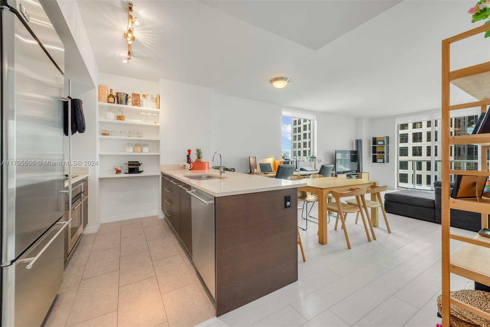 a kitchen with a cabinets and chairs