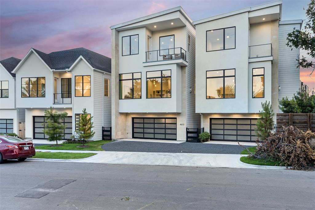 a front view of a house with a garden and parking space