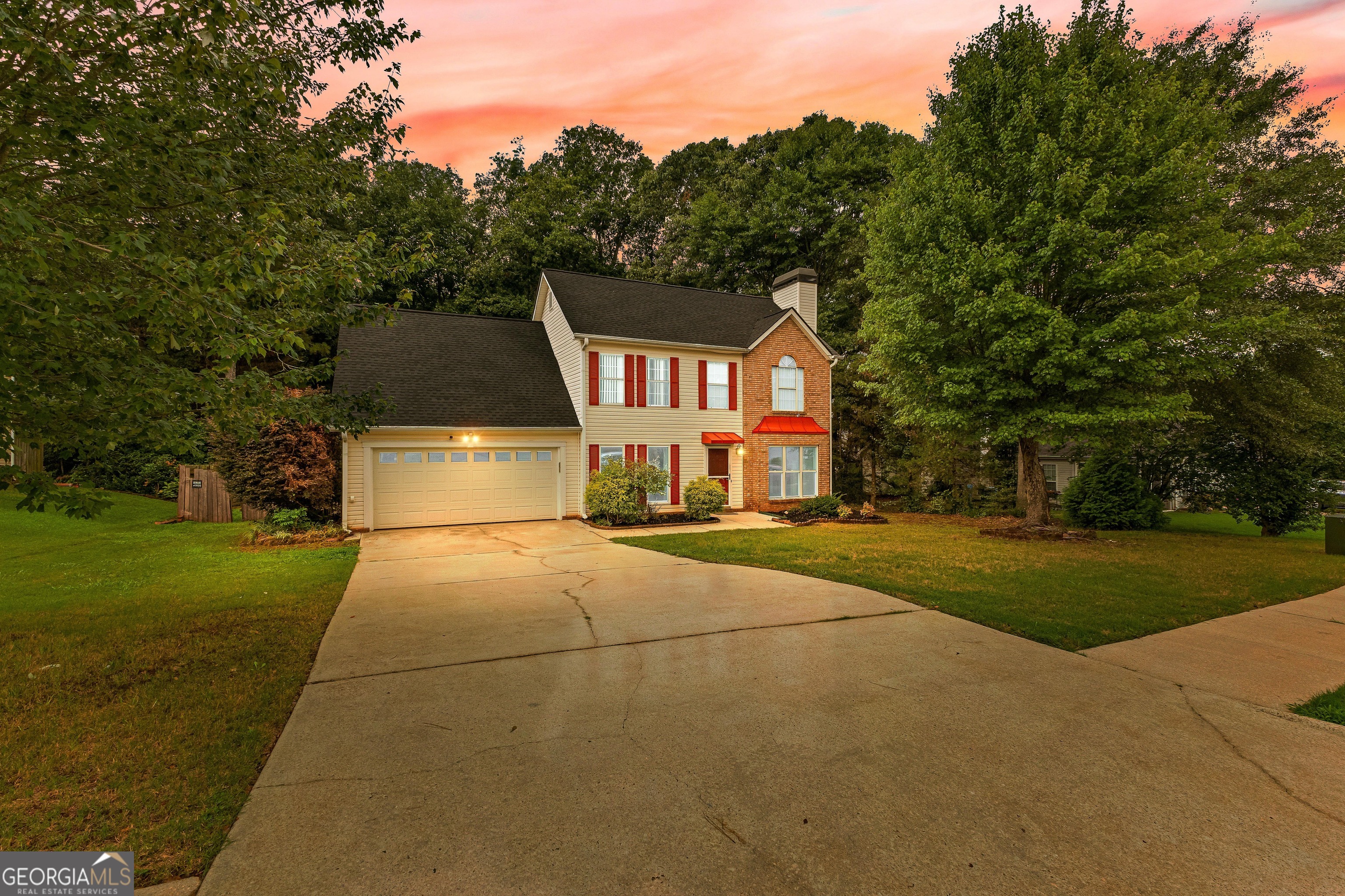 a front view of a house with yard