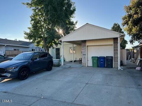 a view of a car parked in front of house