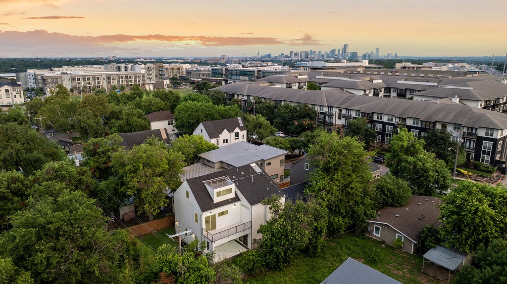 an aerial view of a city with lots of residential buildings