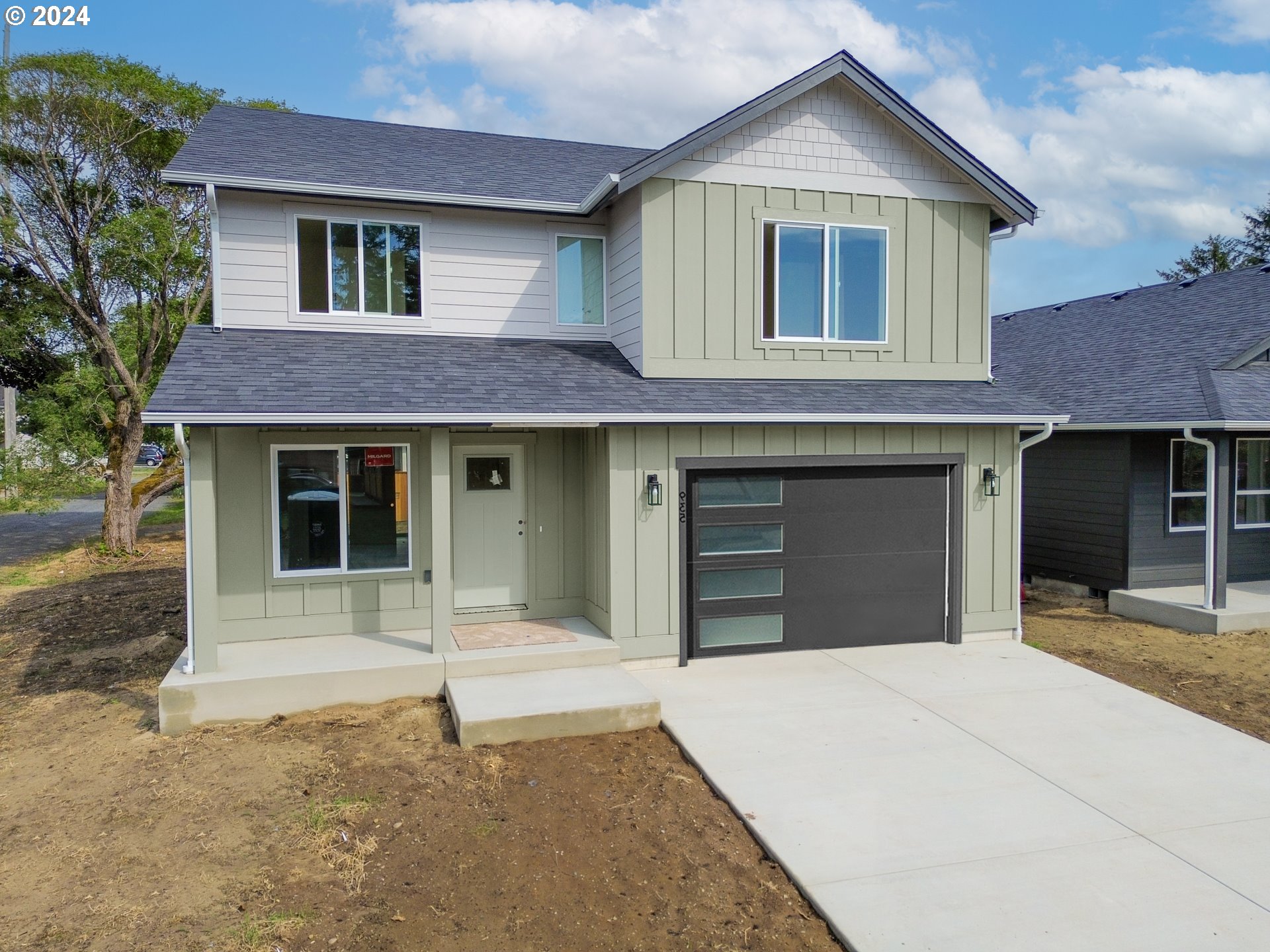 a front view of a house with a garage