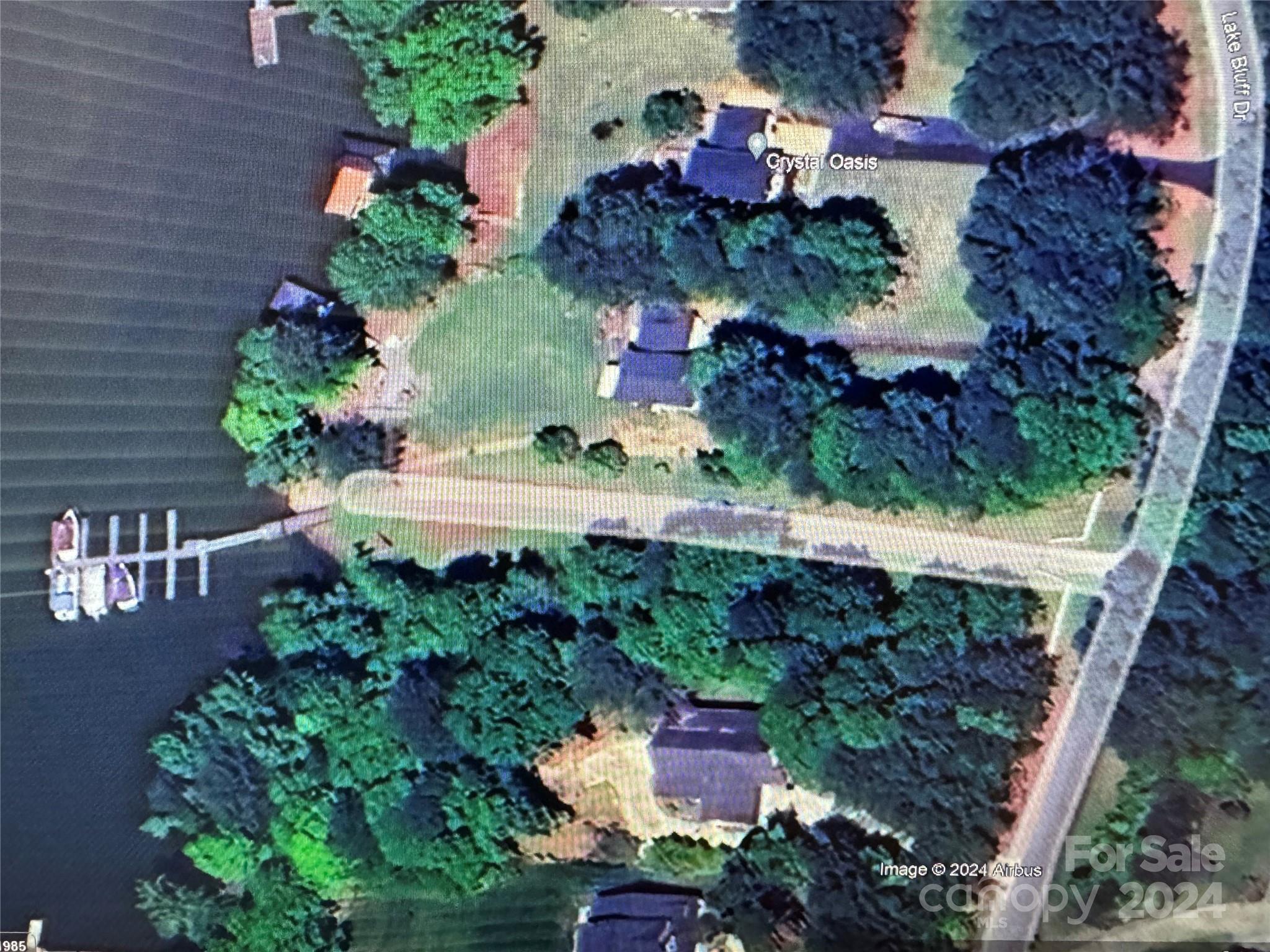 an aerial view of house with a yard