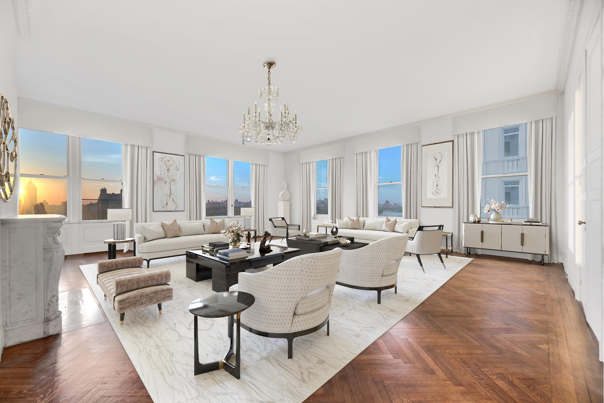 a living room with furniture and a chandelier