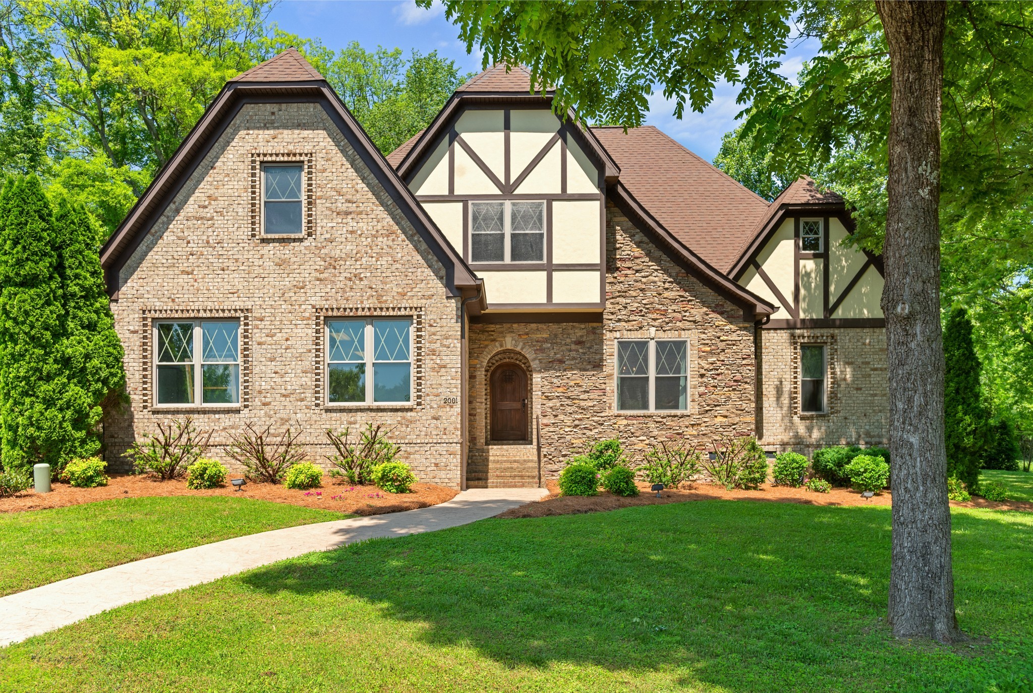 a front view of house with yard and green space