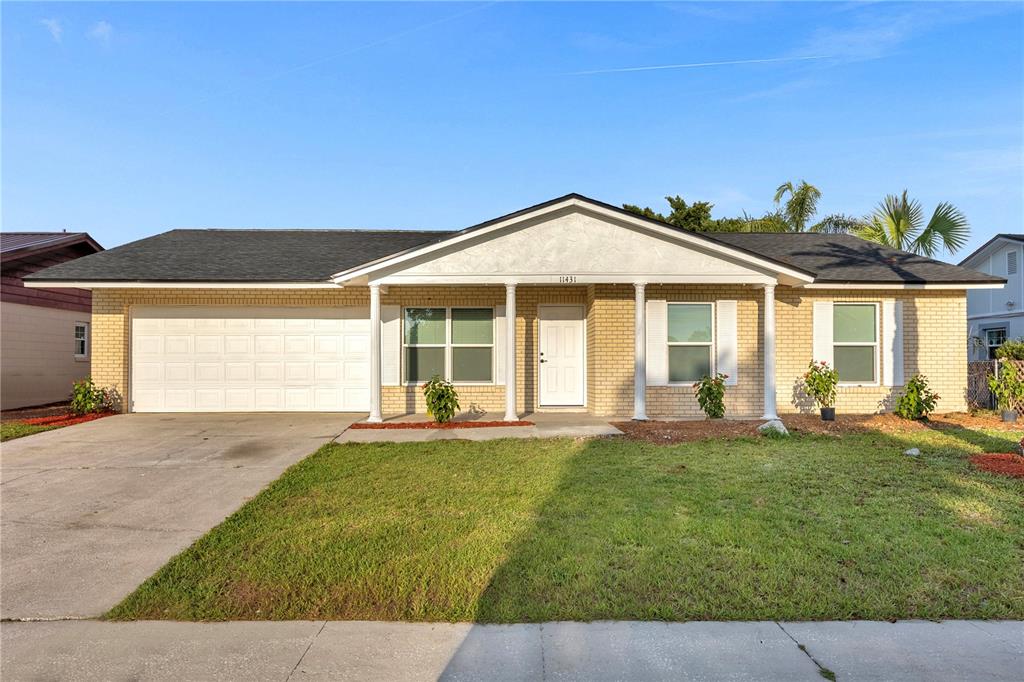 a front view of a house with a yard