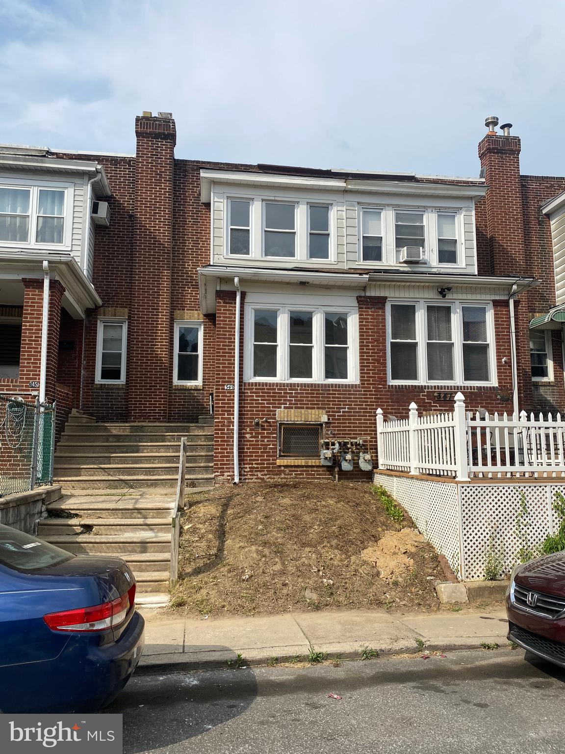 a view of a car park in front of a house