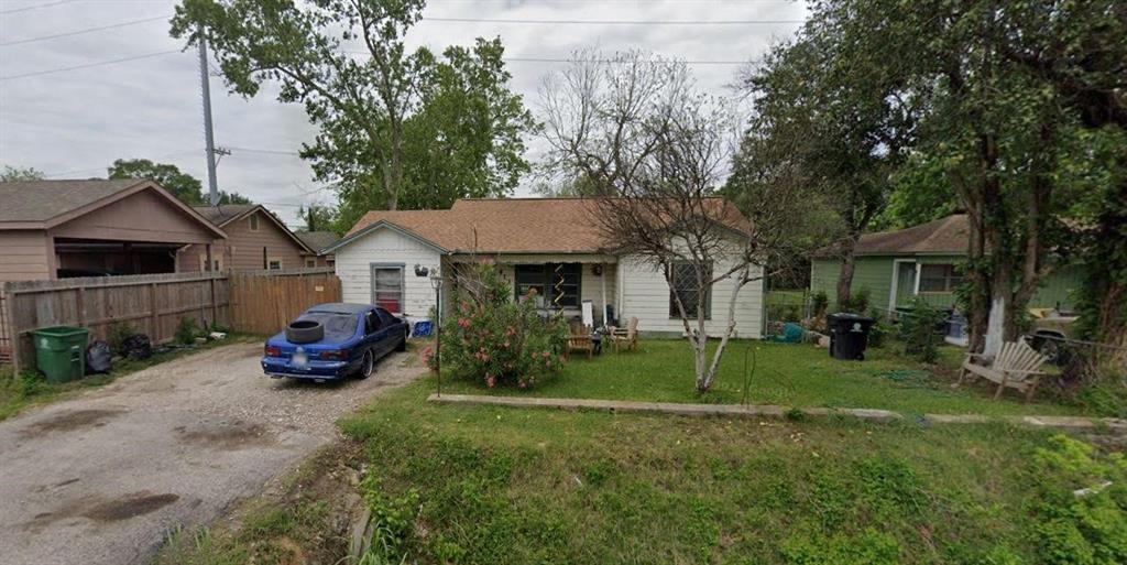 a front view of a house with a yard and porch