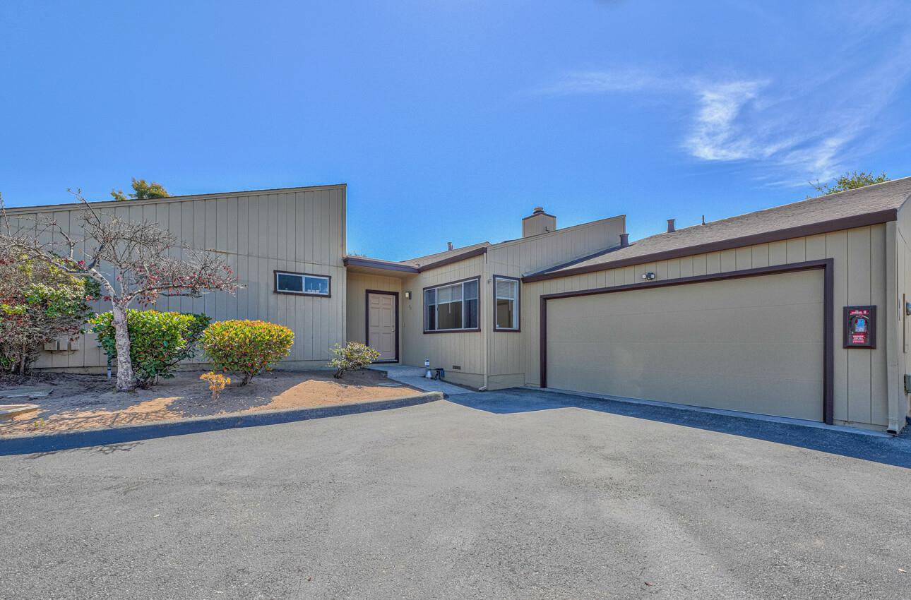 a front view of a house with a garage