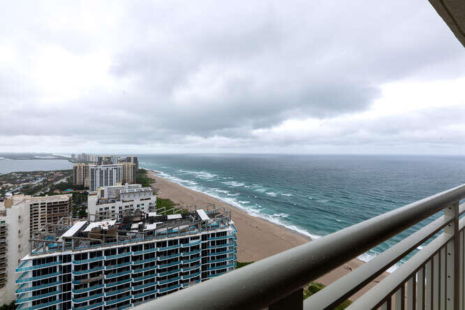 a view of a balcony with city view