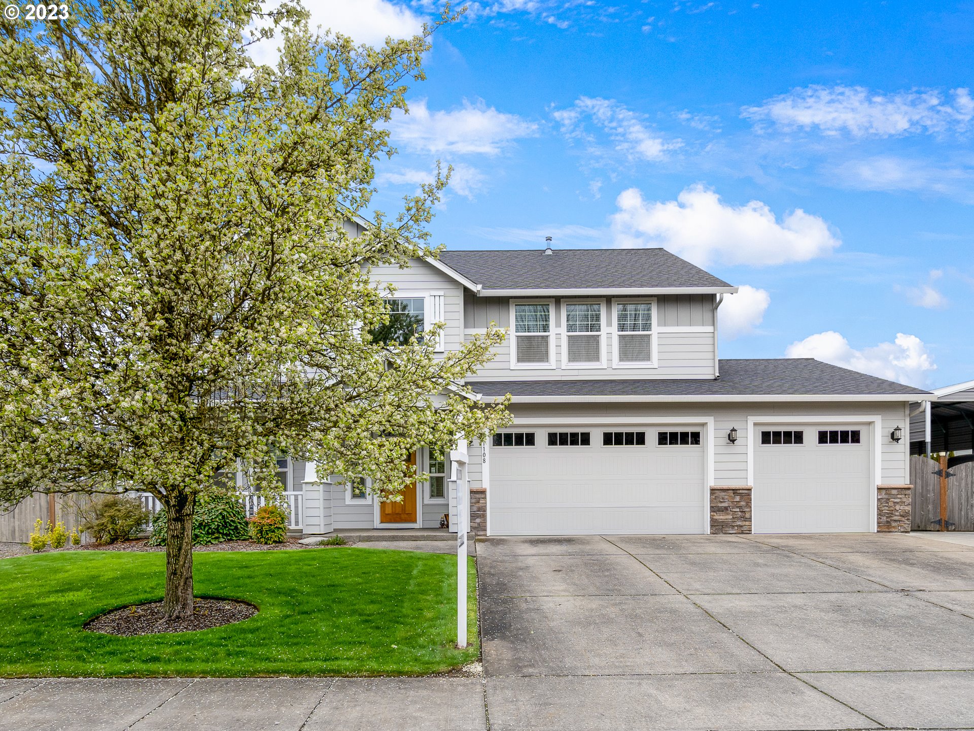 a front view of a house with a yard