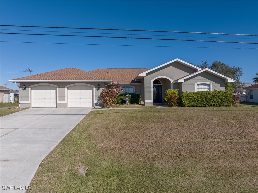 a front view of a house with a yard