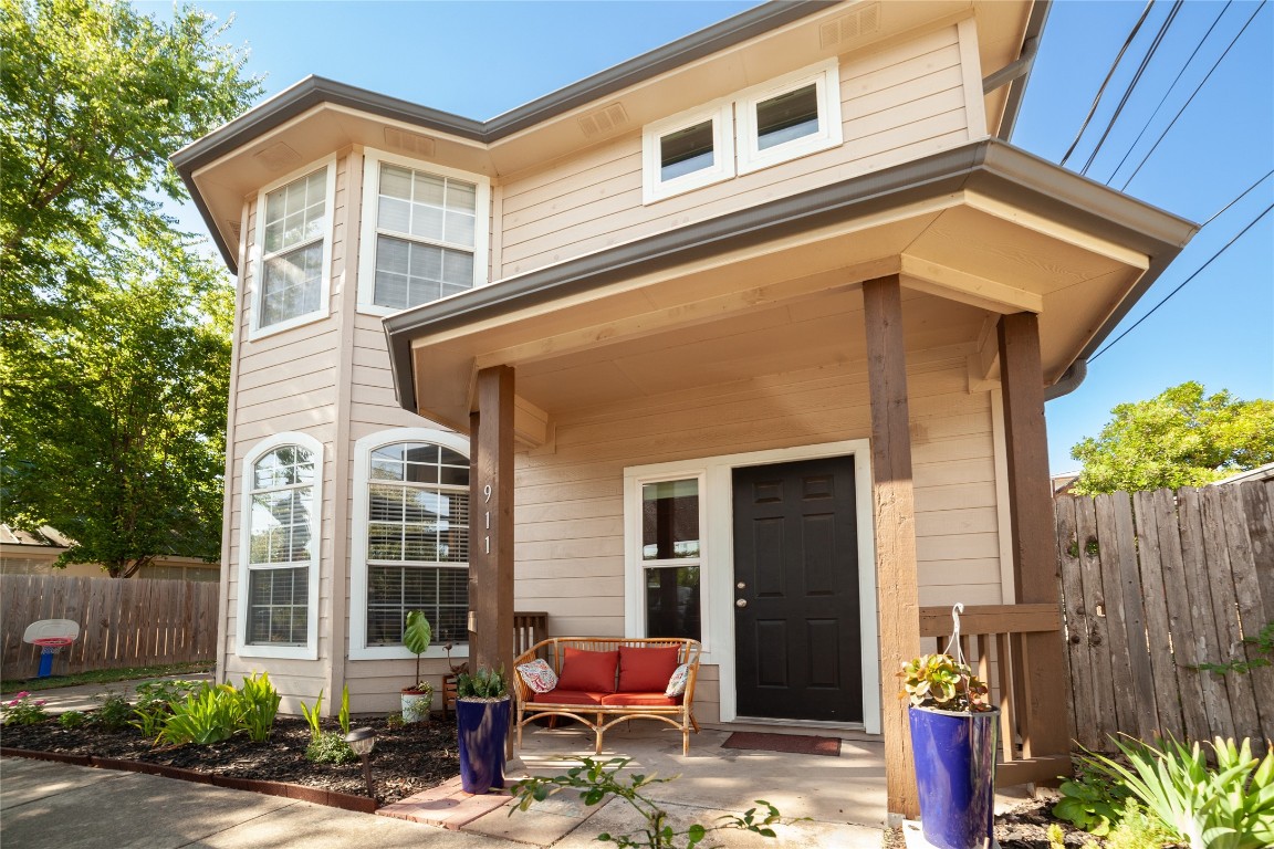 a front view of a house with outdoor seating