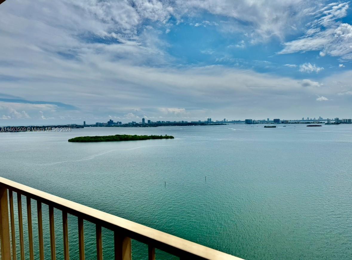 a view of a lake from a balcony