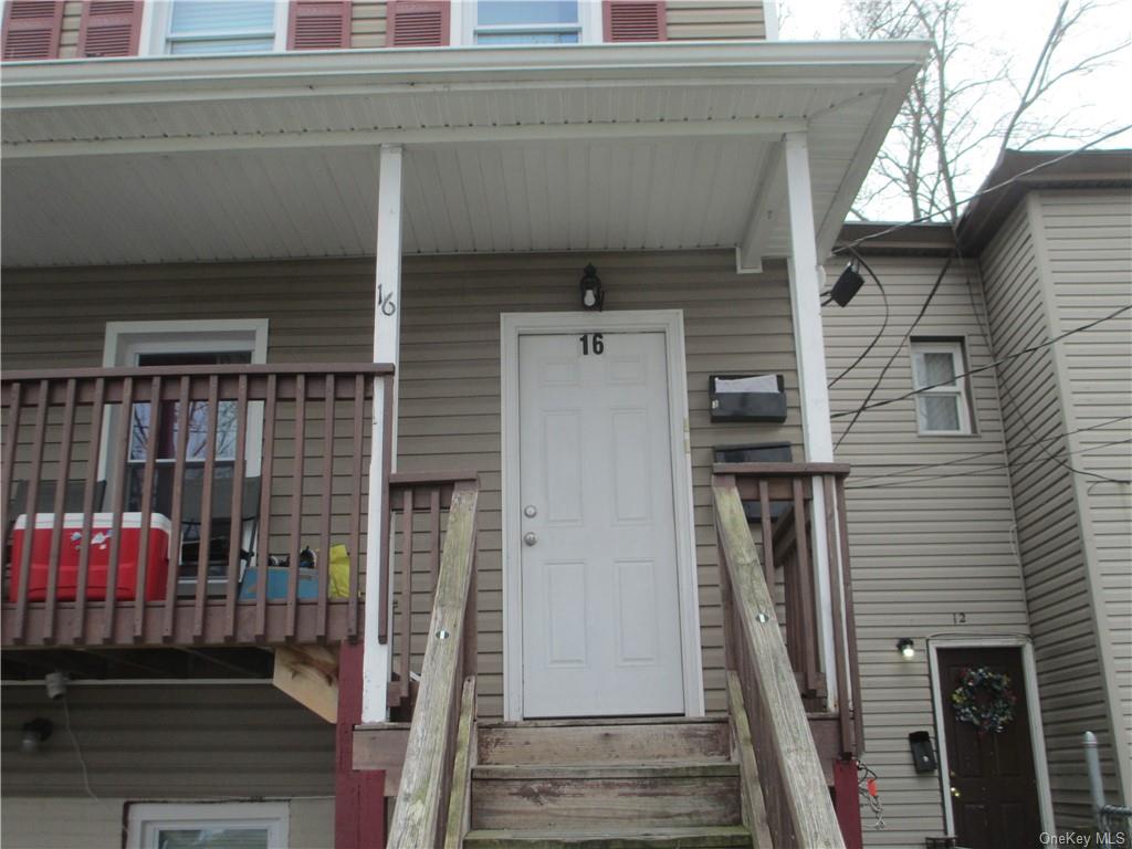 a front view of a house with stairs