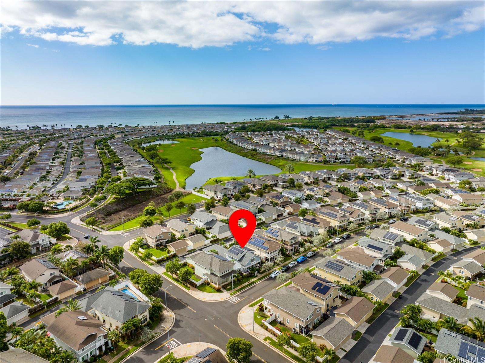 an aerial view of residential houses with outdoor space