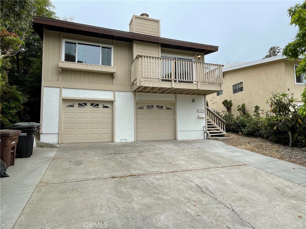 a front view of a house with a garage