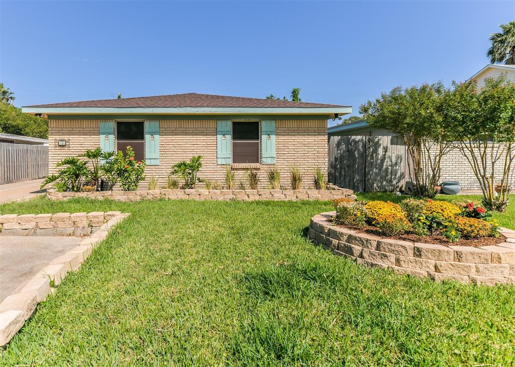 a view of a house with backyard sitting area and garden