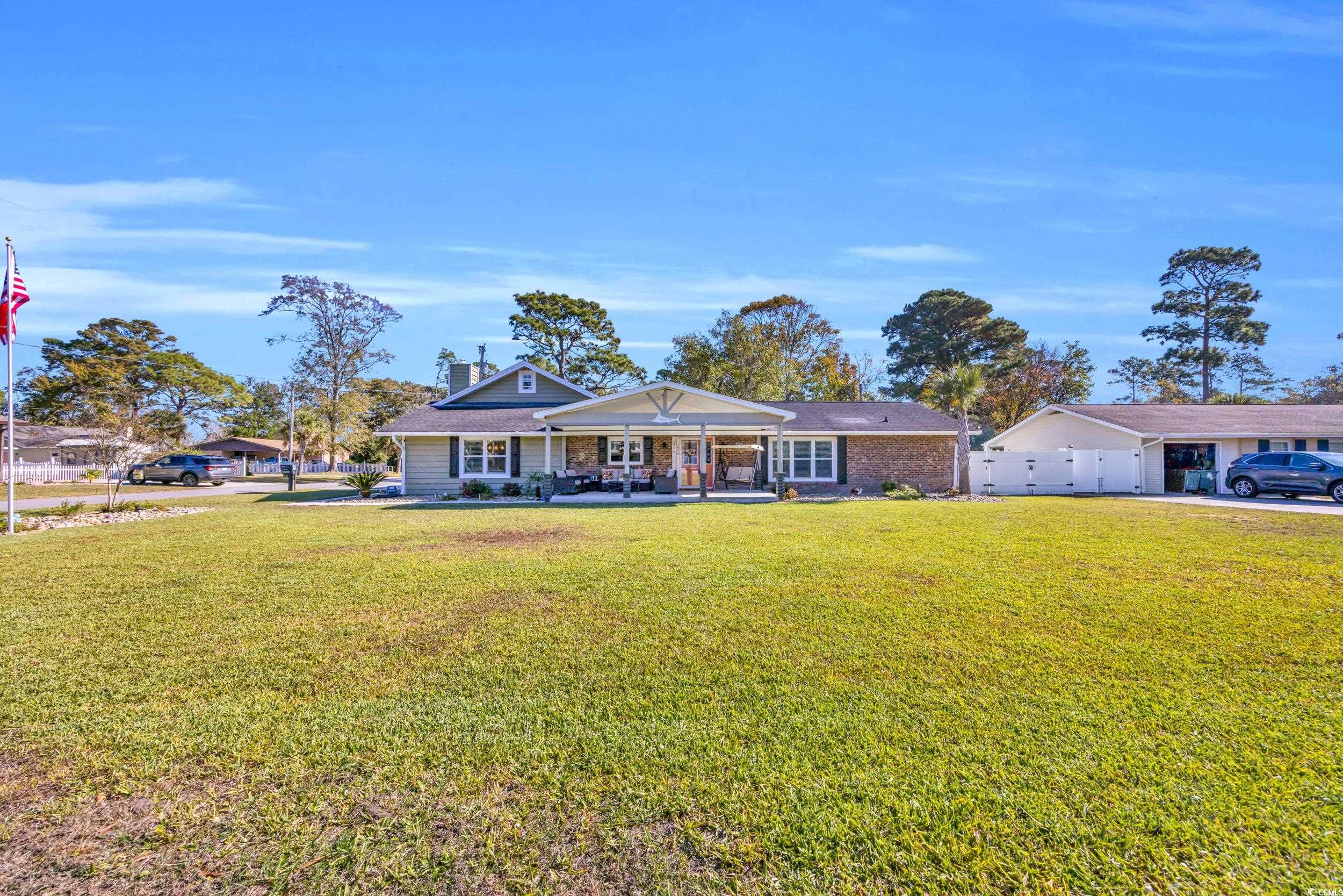 Ranch-style home featuring a front yard