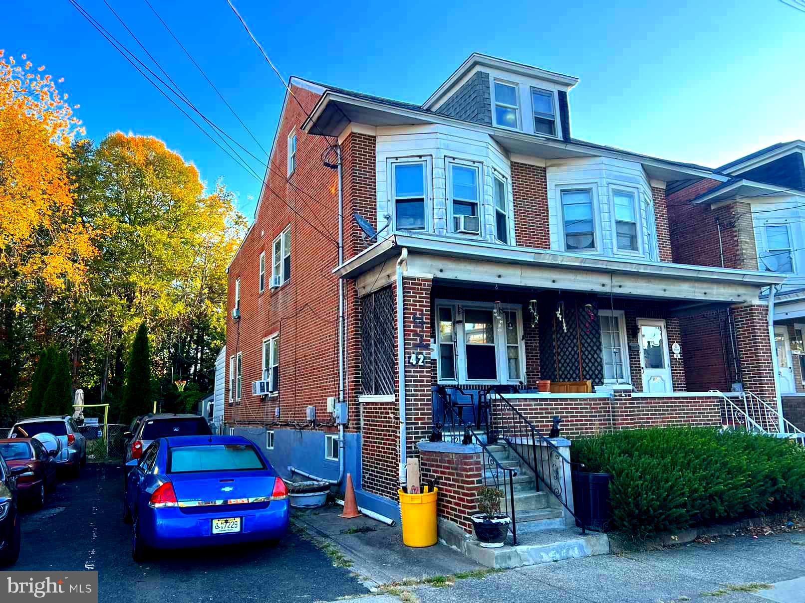 a car parked in front of a house