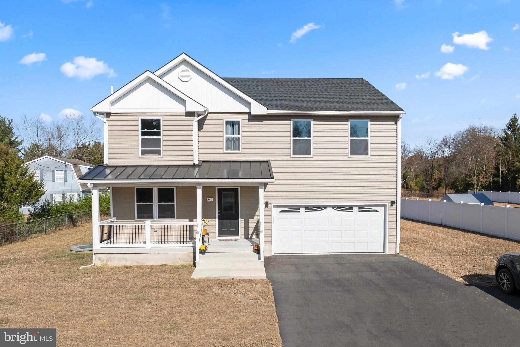 a front view of a house with a garage