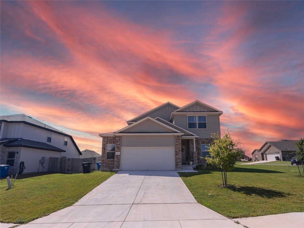 front view of a house with a yard