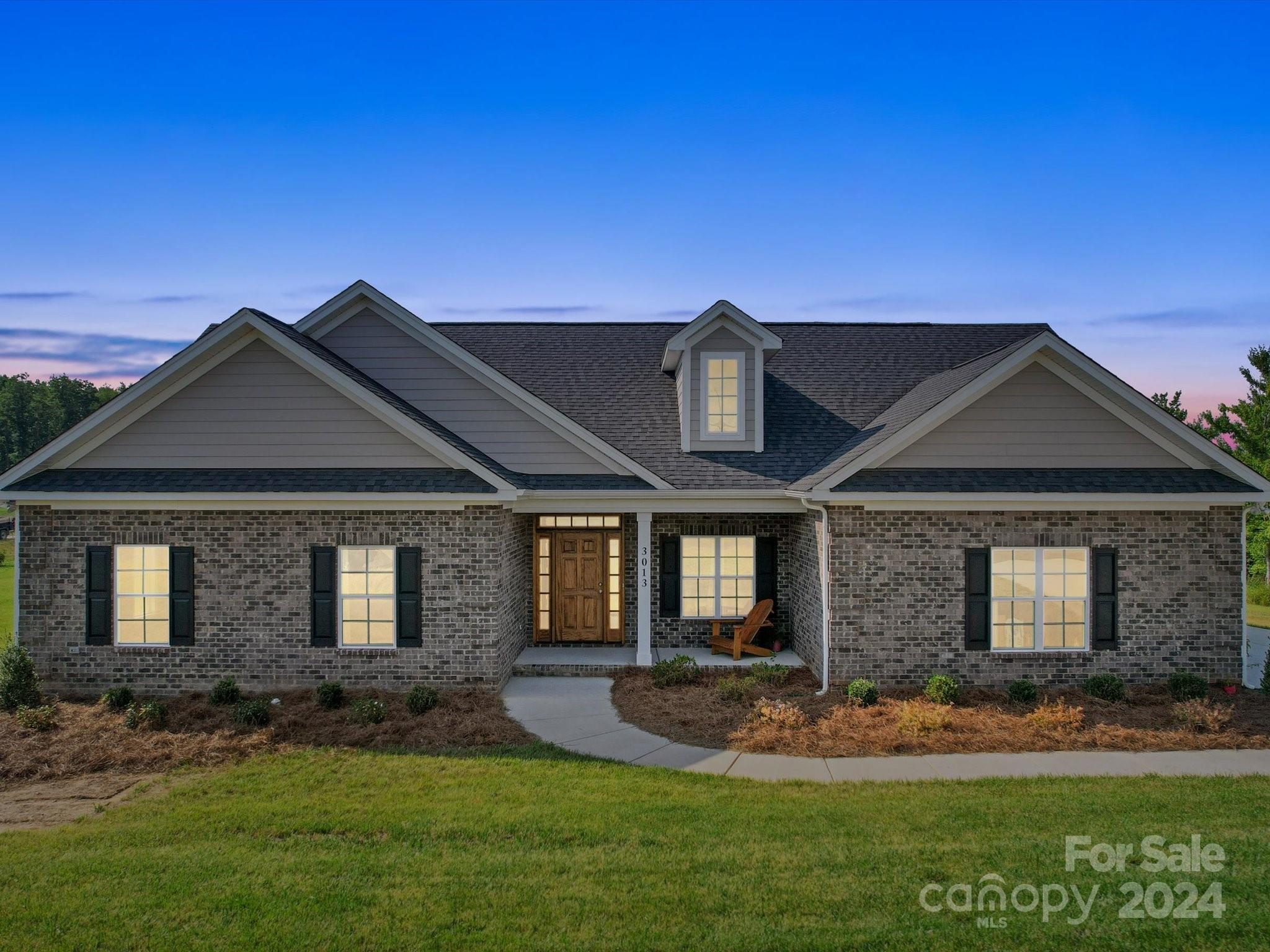 front view of a house with a yard