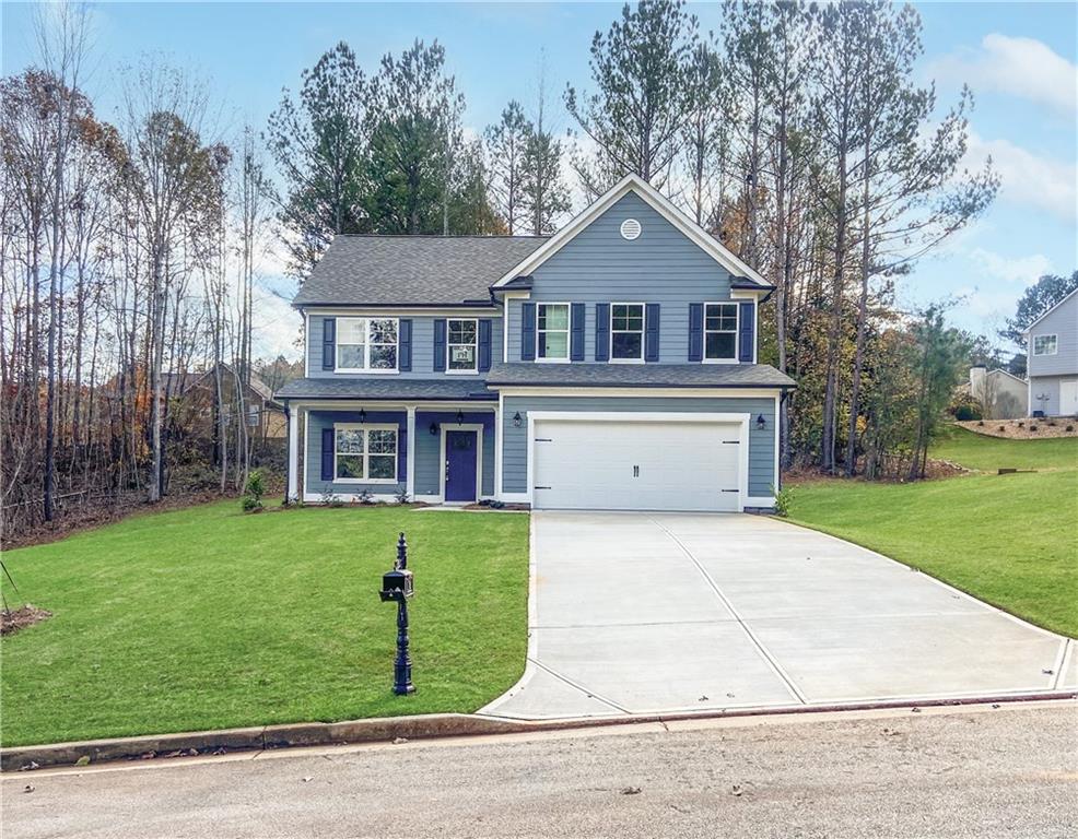 a front view of a house with a yard