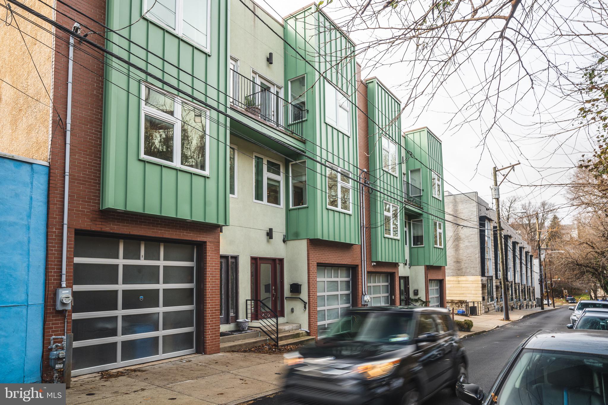 a front view of a building with parking space