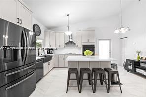 a large kitchen with granite countertop lots of counter space and window