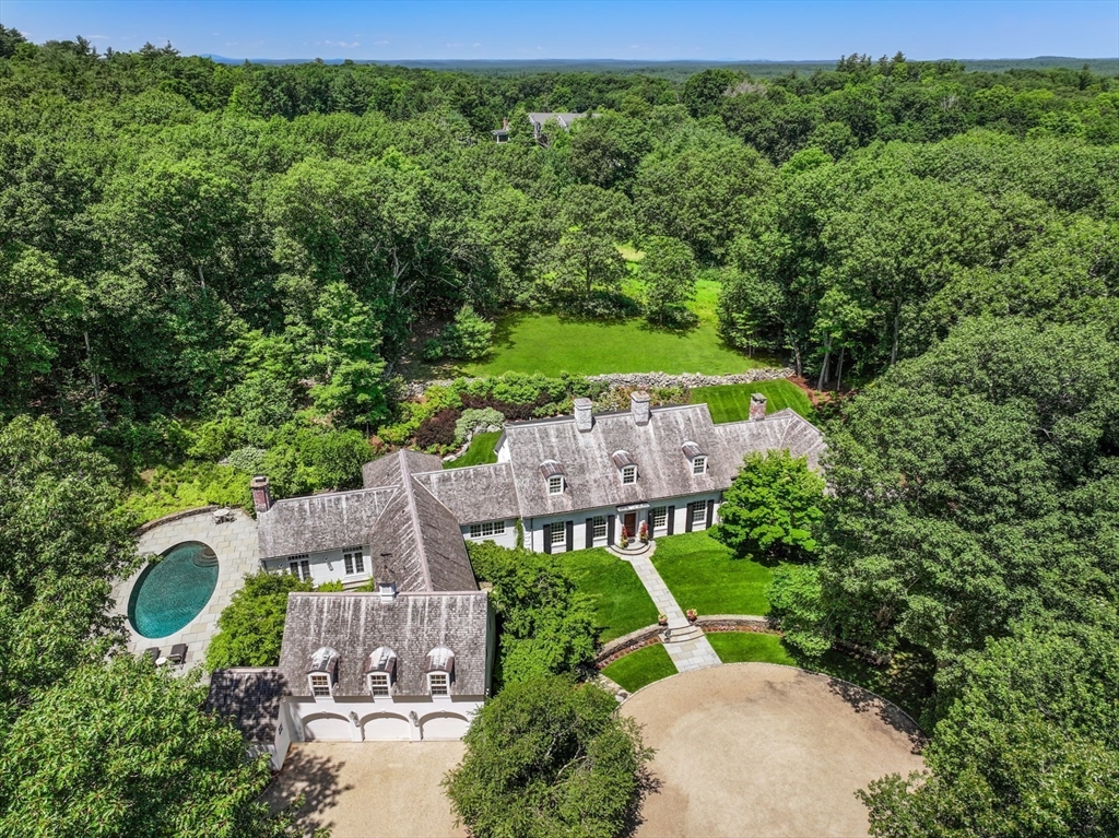 an aerial view of a house with a garden